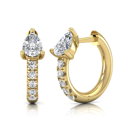Pear cut lab grown diamond huggie hoop earrings featuring a three prong basket set center diamond with round brilliant pavé diamonds on a yellow gold hinged hoop.