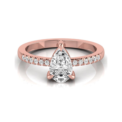 Pear cut lab grown diamond solitaire engagement ring featuring a three-prong setting with a pavé diamond band in rose gold tone.