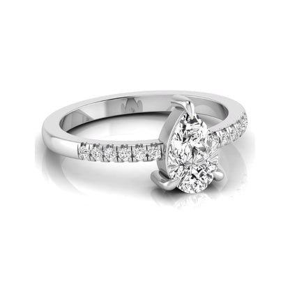 Pear cut lab grown diamond solitaire engagement ring featuring a three-prong setting with a pavé diamond band in white gold tone.