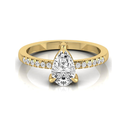 Pear cut lab grown diamond solitaire engagement ring featuring a three-prong setting with a pavé diamond band in yellow gold tone.