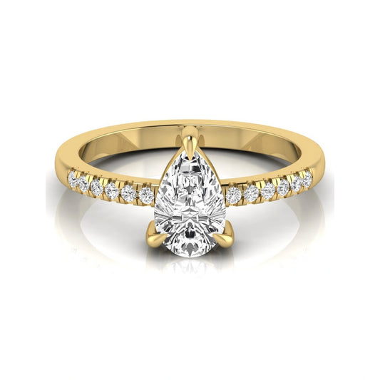 Pear cut lab grown diamond solitaire engagement ring featuring a three-prong setting with a pavé diamond band in yellow gold tone.