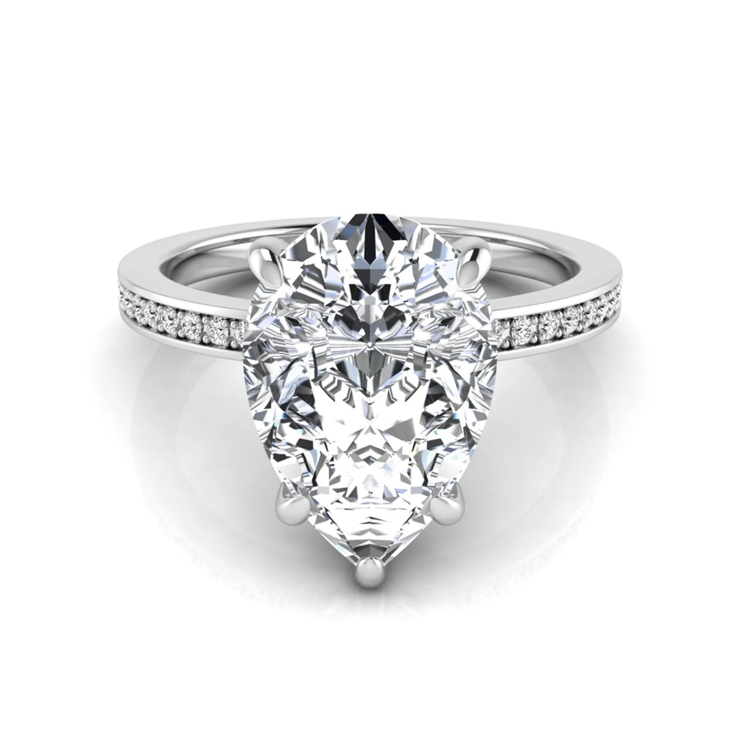 Pear cut lab grown diamond solitaire engagement ring featuring a five-prong setting with a pavé diamond band in white gold tone.