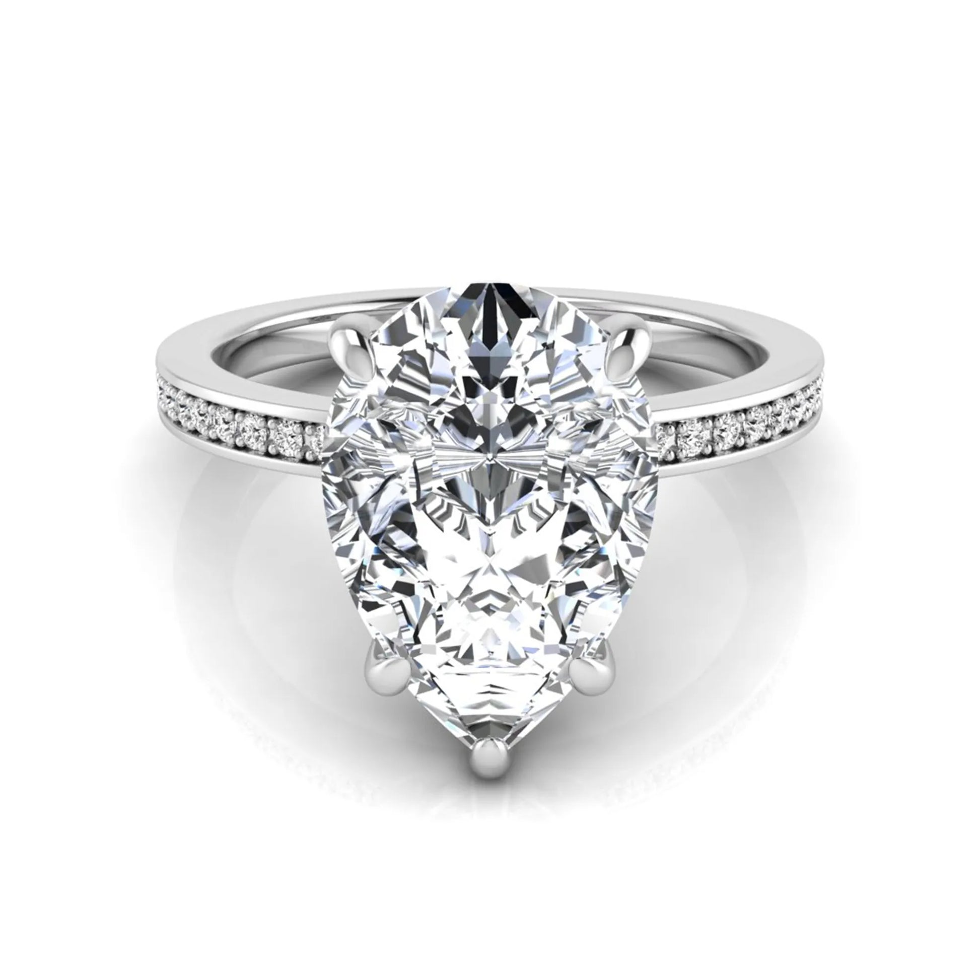 Pear cut lab grown diamond solitaire engagement ring featuring a five-prong setting with a pavé diamond band in white gold tone.