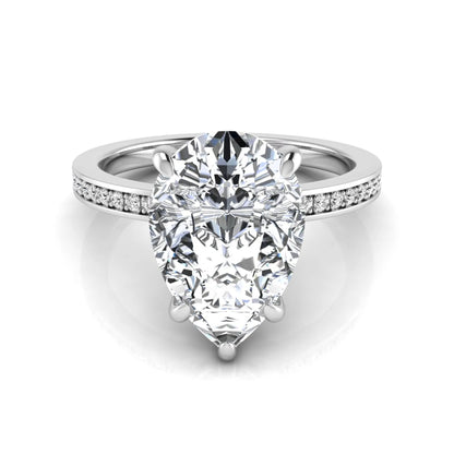 Pear cut lab grown diamond solitaire engagement ring featuring a five-prong setting with a pavé diamond band in white gold tone.
