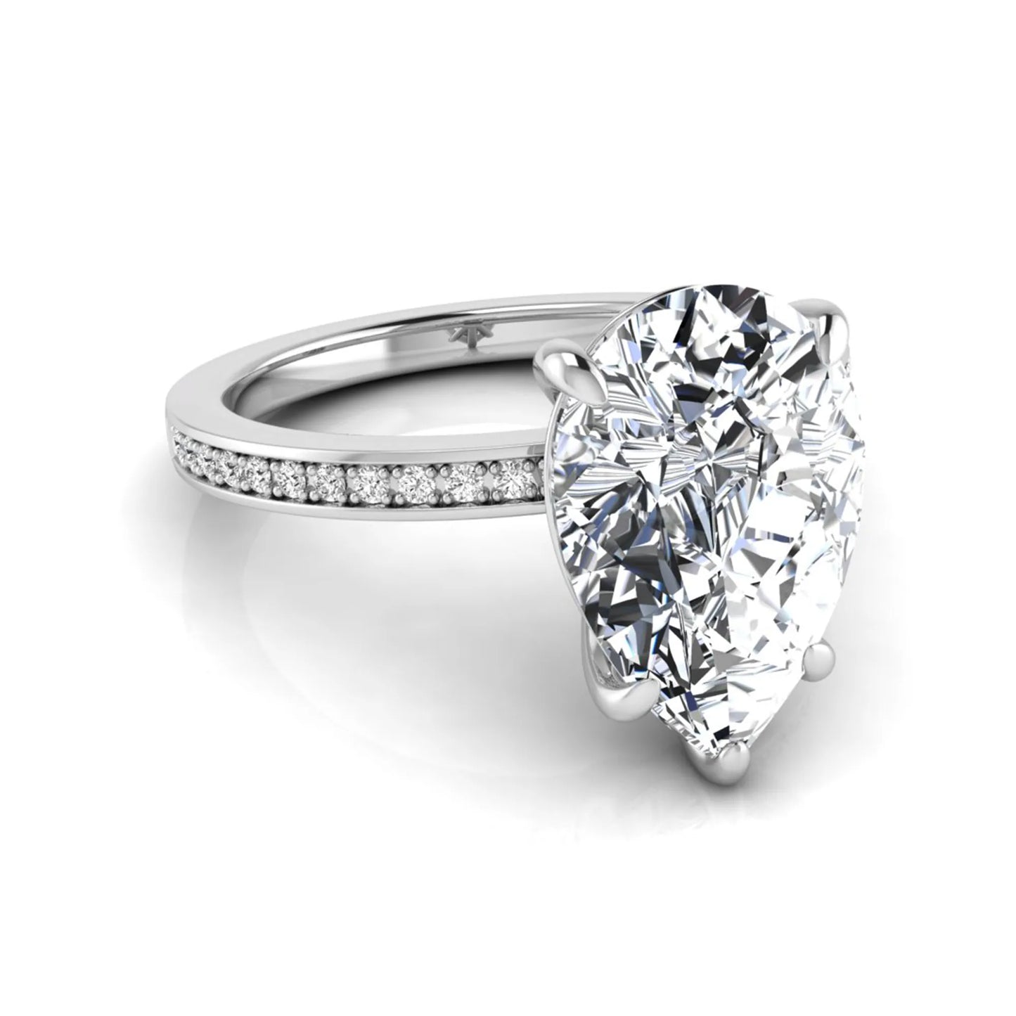 Pear cut lab grown diamond solitaire engagement ring featuring a five-prong setting with a pavé diamond band in white gold tone.