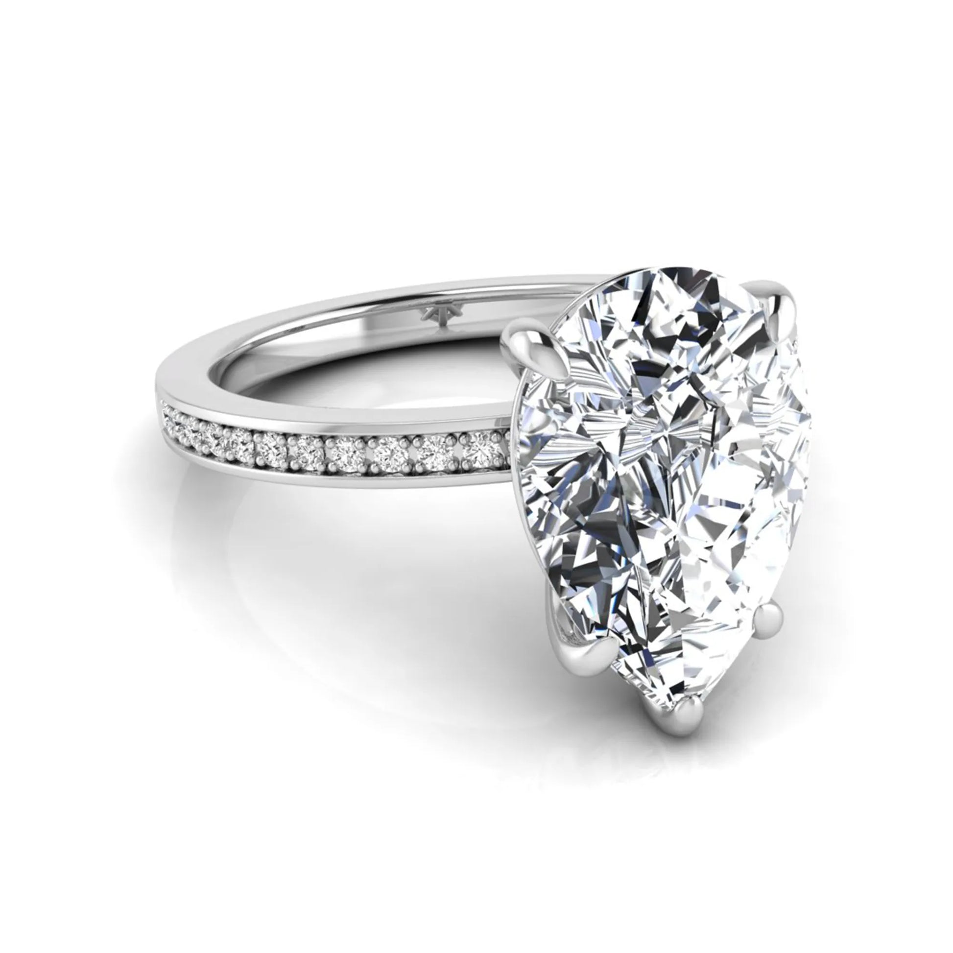 Pear cut lab grown diamond solitaire engagement ring featuring a five-prong setting with a pavé diamond band in white gold tone.