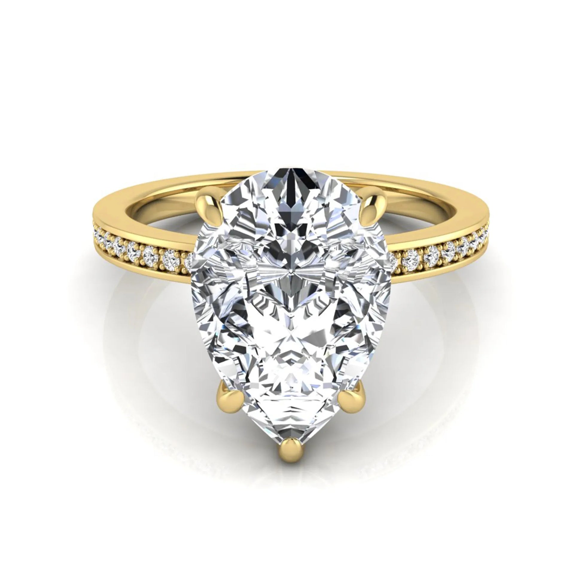 Pear cut lab grown diamond solitaire engagement ring featuring a five-prong setting with a pavé diamond band in yellow gold tone.