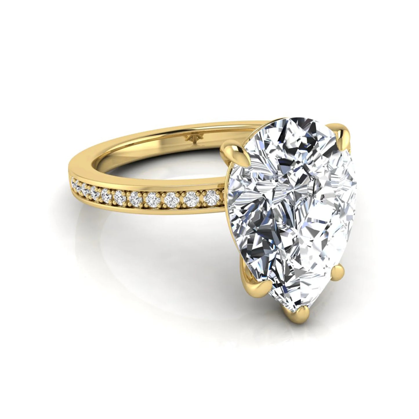 Pear cut lab grown diamond solitaire engagement ring featuring a five-prong setting with a pavé diamond band in yellow gold tone.