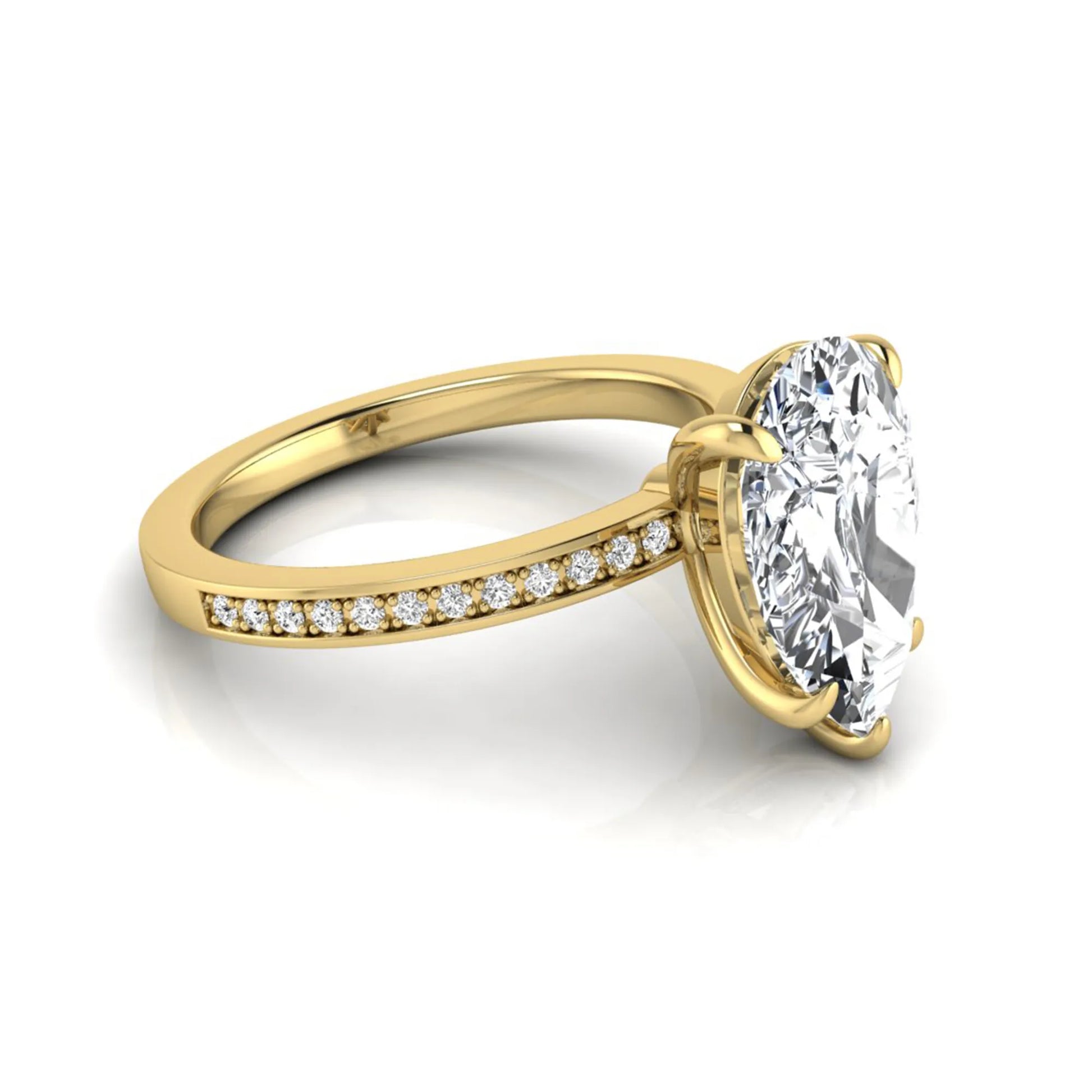 Pear cut lab grown diamond solitaire engagement ring featuring a five-prong setting with a pavé diamond band in yellow gold tone.