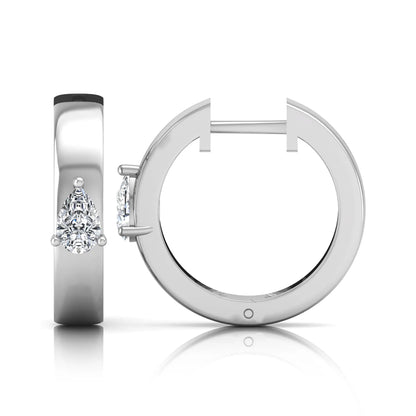 Pear cut lab grown diamond huggie hoop earrings with prong setting and hinged snap closure shown in white gold tone for display.