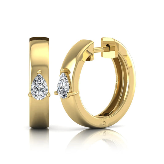 Pear cut lab grown diamond huggie hoop earrings with prong setting and hinged snap closure shown in yellow gold tone for display.