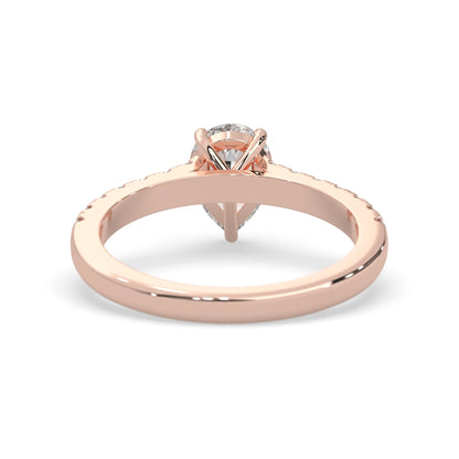 pear cut lab grown diamond prong set engagement ring with pavé band and rose gold  metal tone design