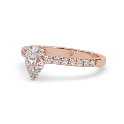 pear cut lab grown diamond prong set engagement ring with pavé band and rose gold  metal tone design