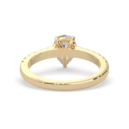 pear cut lab grown diamond prong set engagement ring with pavé band and yellow gold  metal tone design