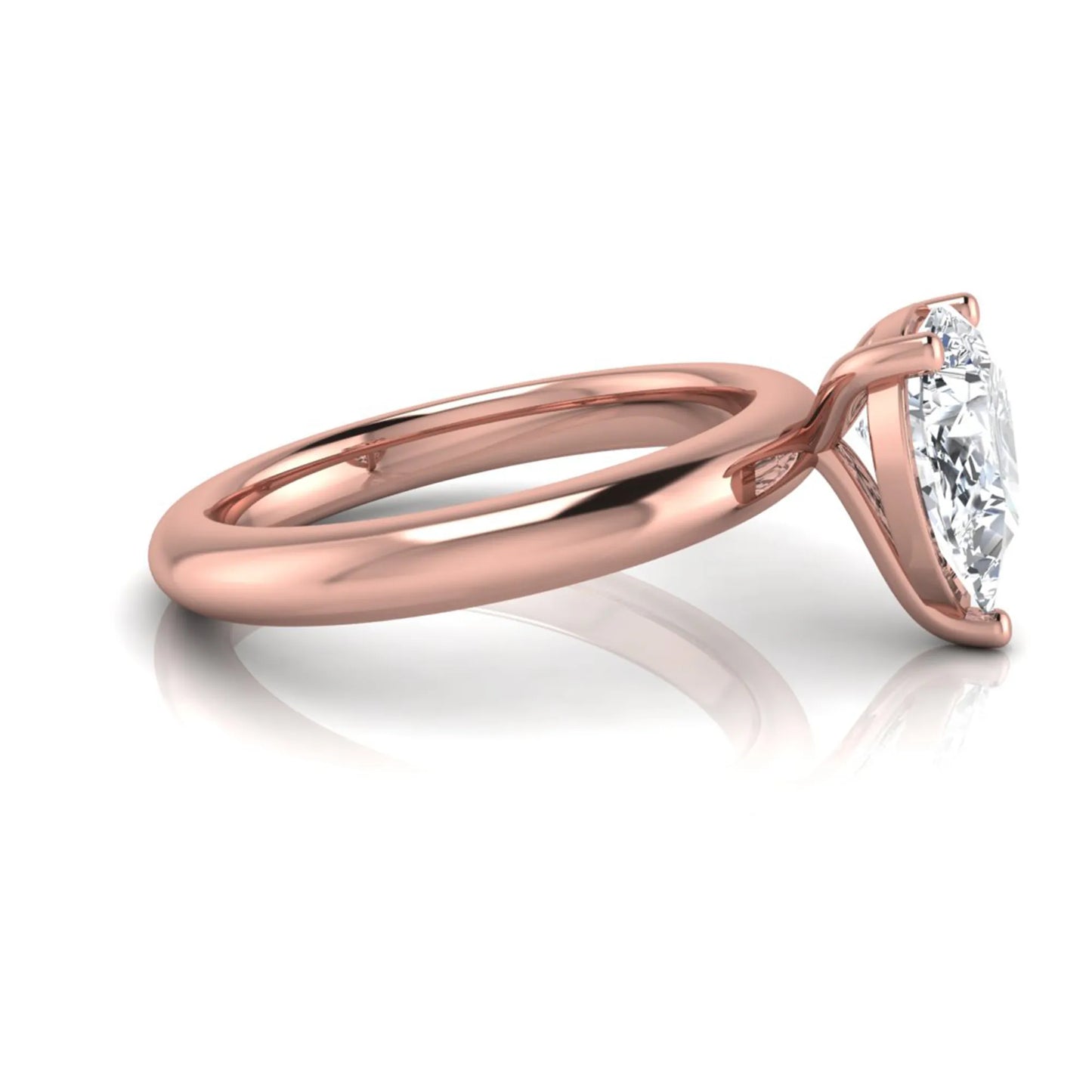 Pear cut lab grown diamond solitaire engagement ring featuring a classic three-prong setting with a polished rose gold tapered band.
