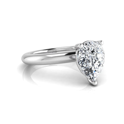 Pear cut lab grown diamond solitaire engagement ring featuring a classic three-prong setting with a polished white gold tapered band.