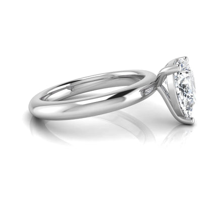 Pear cut lab grown diamond solitaire engagement ring featuring a classic three-prong setting with a polished white gold tapered band.