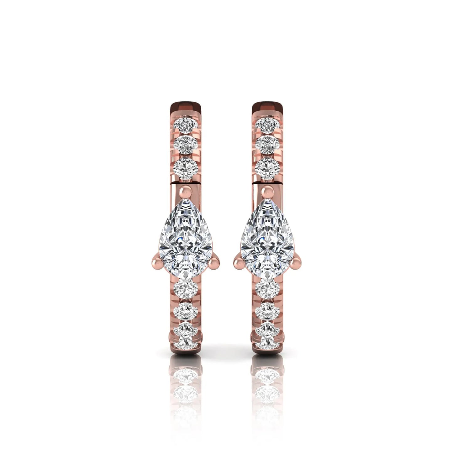 Pear and round cut lab grown diamond pavé huggie hoop earrings featuring a three prong pear diamond center, shared prong round diamond accents, hinged snap closure, and polished rose gold finish.