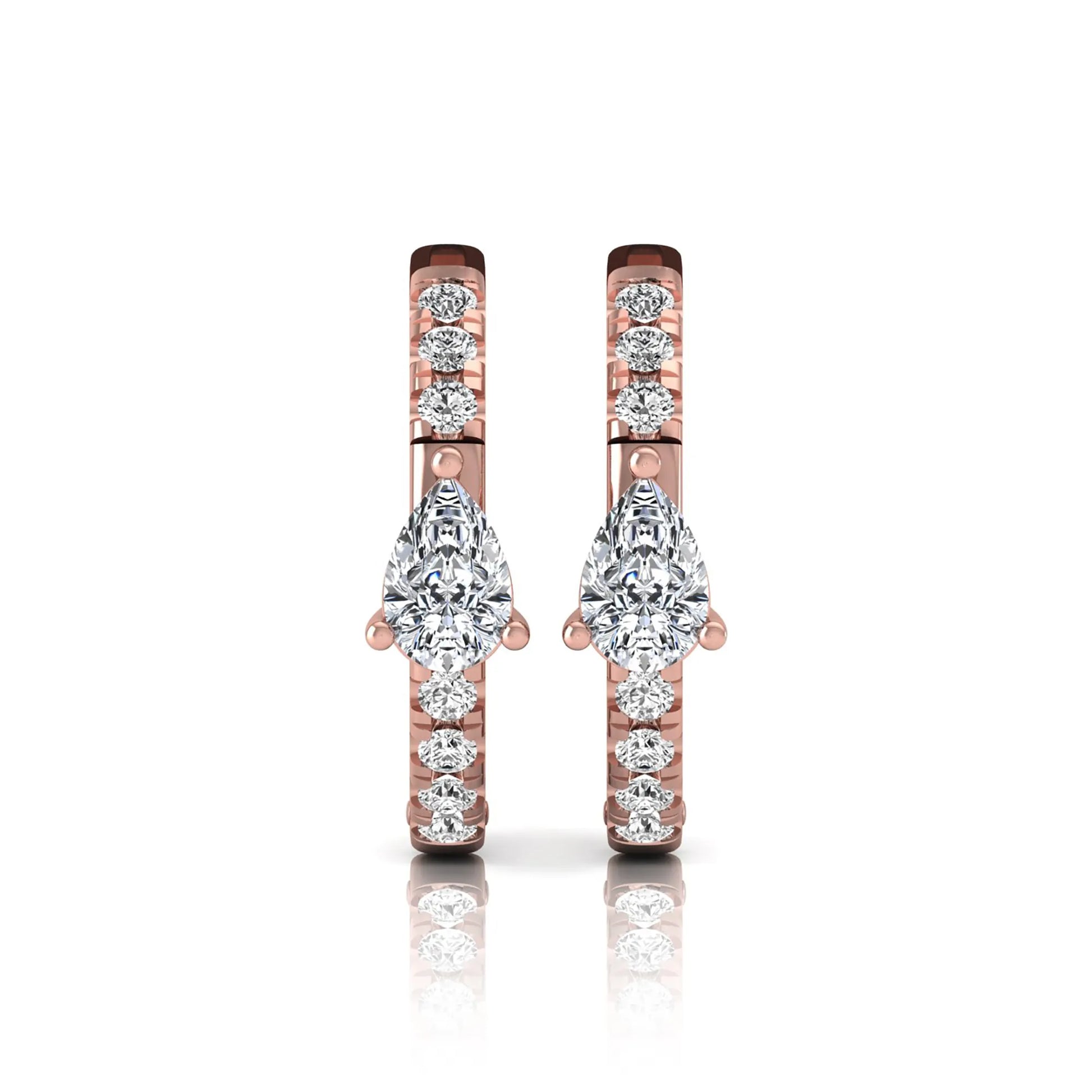Pear and round cut lab grown diamond pavé huggie hoop earrings featuring a three prong pear diamond center, shared prong round diamond accents, hinged snap closure, and polished rose gold finish.