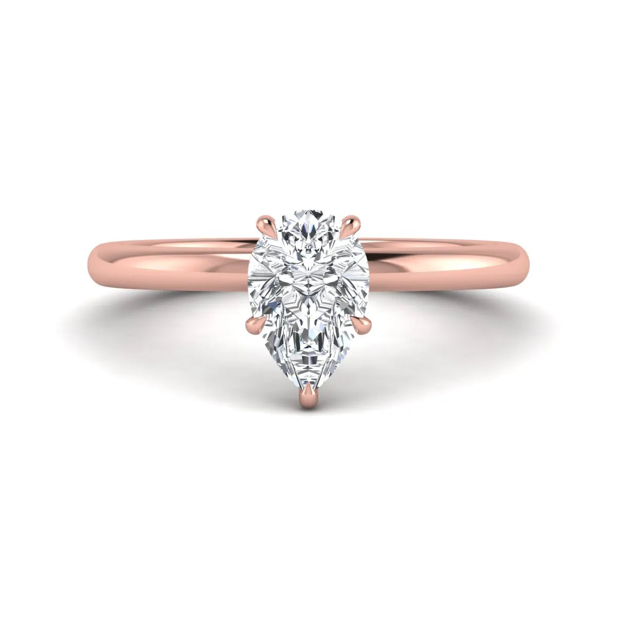 Pear cut lab grown diamond solitaire engagement ring in a four-prong rose gold setting
