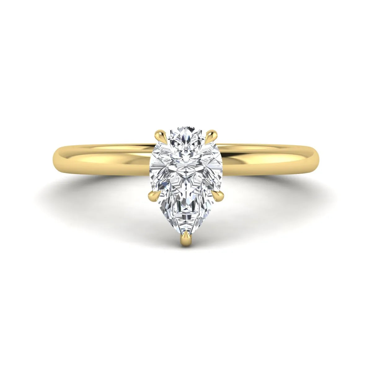 Pear cut lab grown diamond solitaire engagement ring in a four-prong yellow gold setting