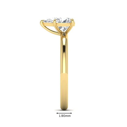 Pear cut lab grown diamond solitaire engagement ring in a four-prong yellow gold setting