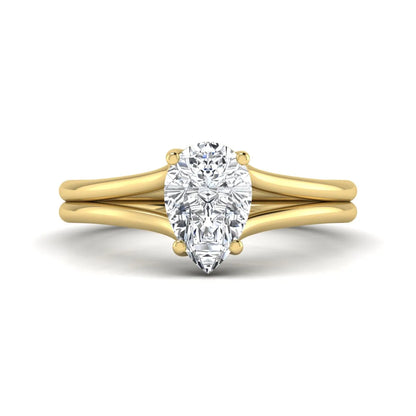 IGI certified 1.34 carat pear cut lab grown diamond solitaire engagement ring with elegant split shank in yellow gold.