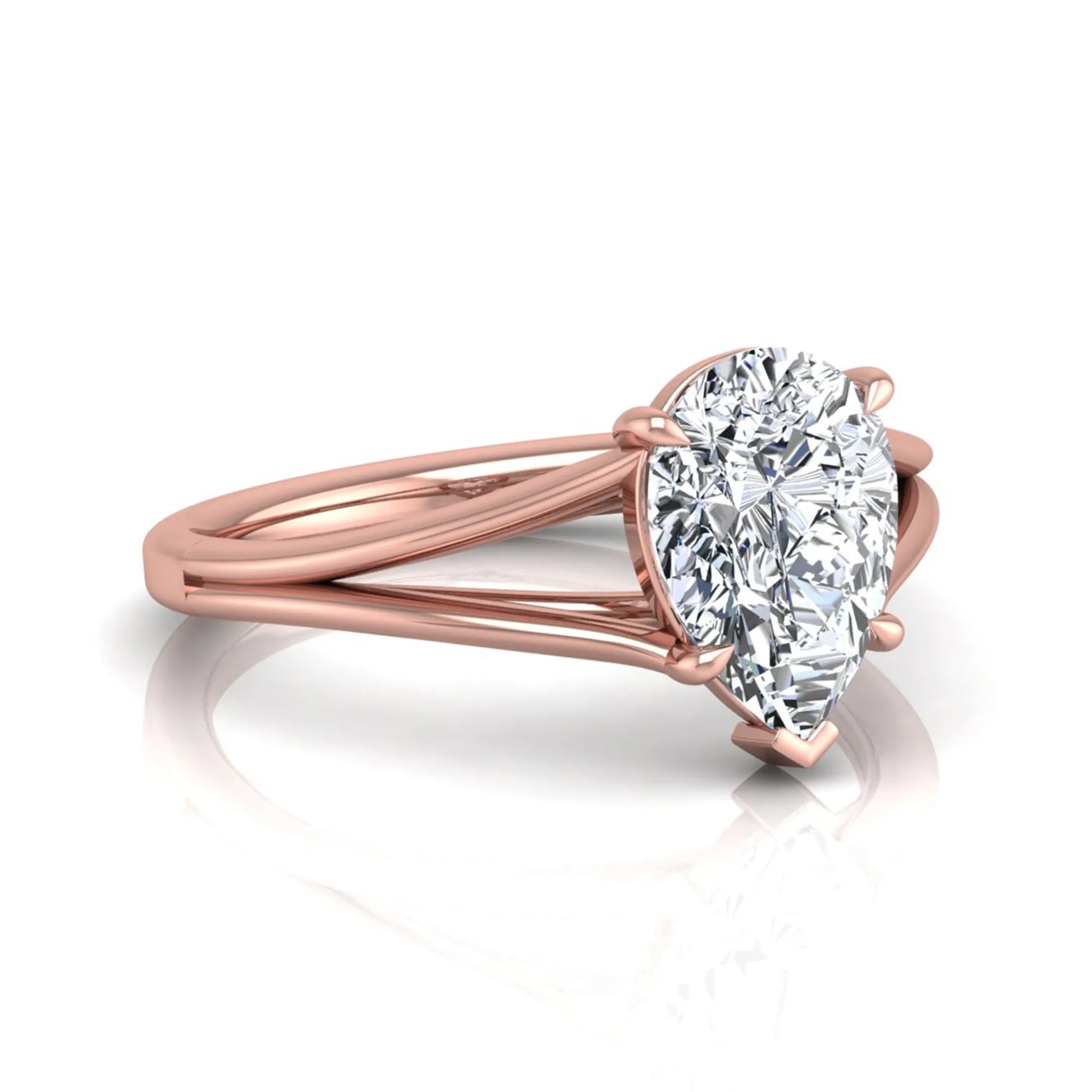 Pear cut lab grown diamond solitaire engagement ring with an elegant split shank and classic prong setting in rose gold