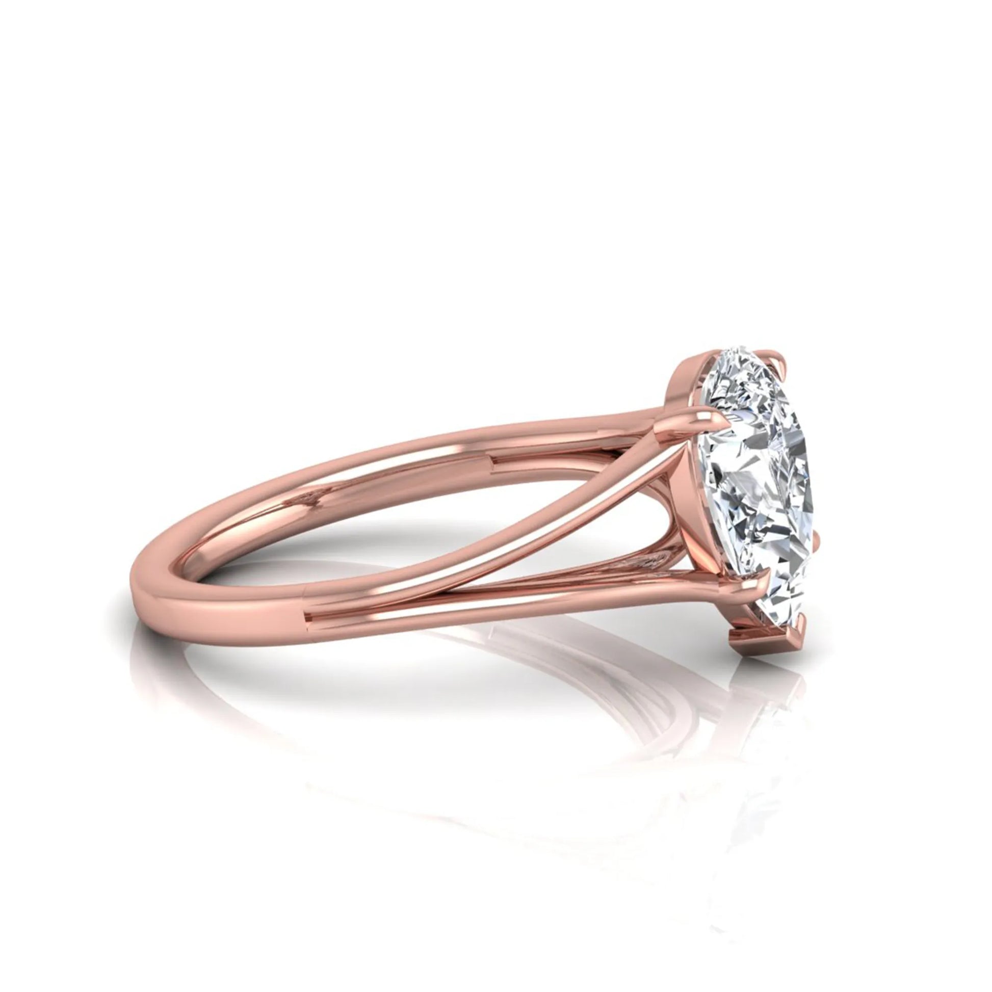 Pear cut lab grown diamond solitaire engagement ring with an elegant split shank and classic prong setting in rose gold