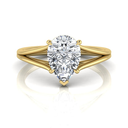 Pear cut lab grown diamond solitaire engagement ring with an elegant split shank and classic prong setting in yellow gold