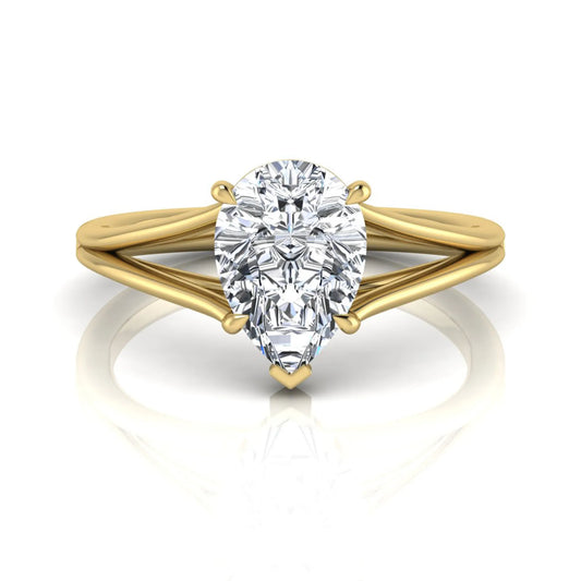 Pear cut lab grown diamond solitaire engagement ring with an elegant split shank and classic prong setting in yellow gold