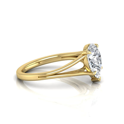 Pear cut lab grown diamond solitaire engagement ring with an elegant split shank and classic prong setting in yellow gold