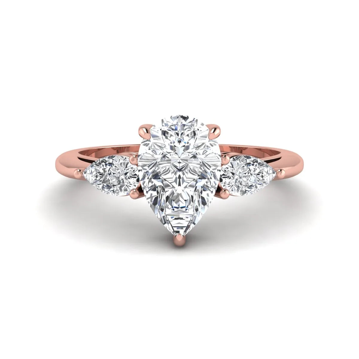 Pear three stone lab grown diamond engagement ring featuring a 1.33 carat IGI certified pear cut center diamond with pear cut side diamonds in rose gold.