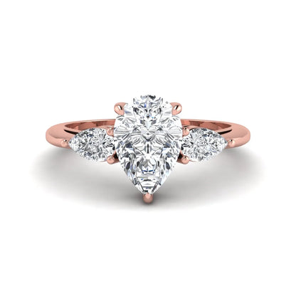 Pear three stone lab grown diamond engagement ring featuring a 1.33 carat IGI certified pear cut center diamond with pear cut side diamonds in rose gold.