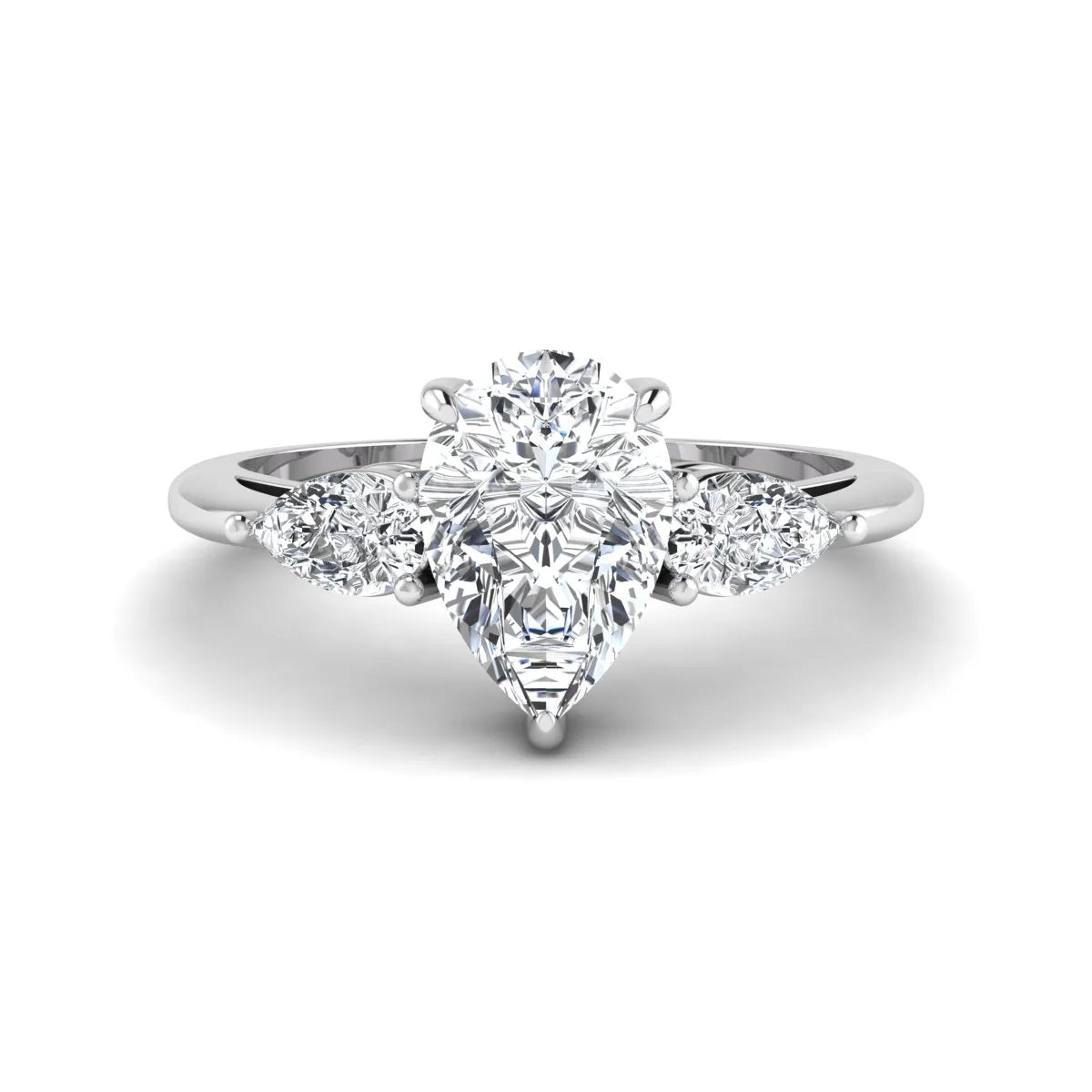 Pear three stone lab grown diamond engagement ring featuring a 1.33 carat IGI certified pear cut center diamond with pear cut side diamonds in white gold.