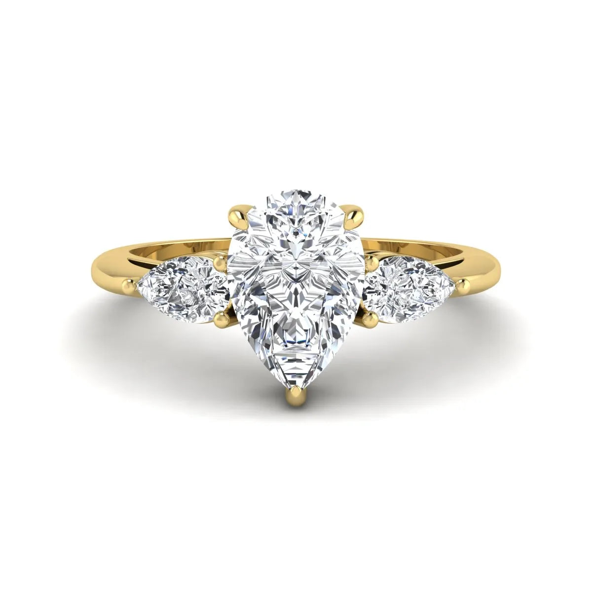 Pear three stone lab grown diamond engagement ring featuring a 1.33 carat IGI certified pear cut center diamond with pear cut side diamonds in yellow gold.