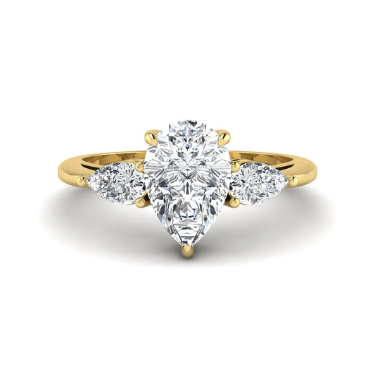 Pear three stone lab grown diamond engagement ring featuring a 1.33 carat IGI certified pear cut center diamond with pear cut side diamonds in yellow gold.