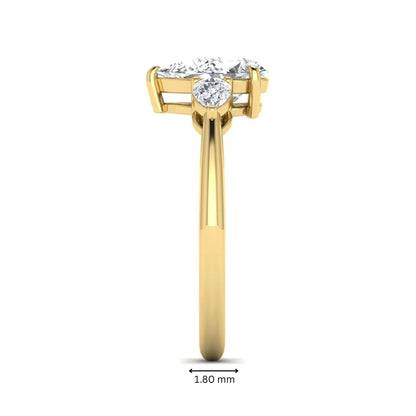 Pear three stone lab grown diamond engagement ring featuring a 1.33 carat IGI certified pear cut center diamond with pear cut side diamonds in yellow gold.
