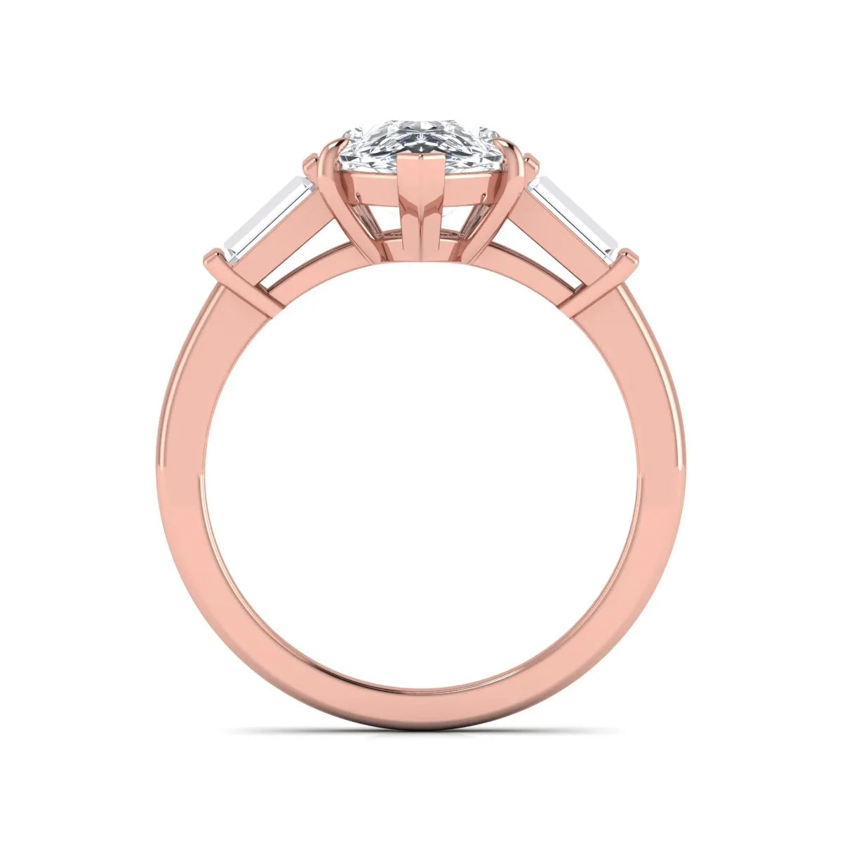 Pear cut lab grown diamond three stone engagement ring with baguette side diamonds in a classic prong setting in rose gold
