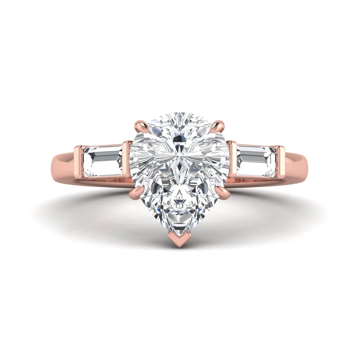 Pear cut lab grown diamond three stone engagement ring with baguette side diamonds in a classic prong setting in rose gold