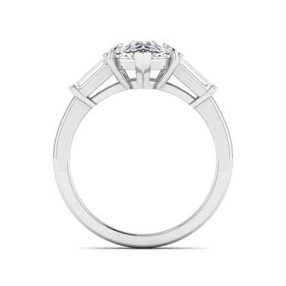 Pear cut lab grown diamond three stone engagement ring with baguette side diamonds in a classic prong setting in white gold