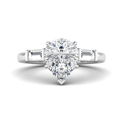 Pear cut lab grown diamond three stone engagement ring with baguette side diamonds in a classic prong setting in white gold