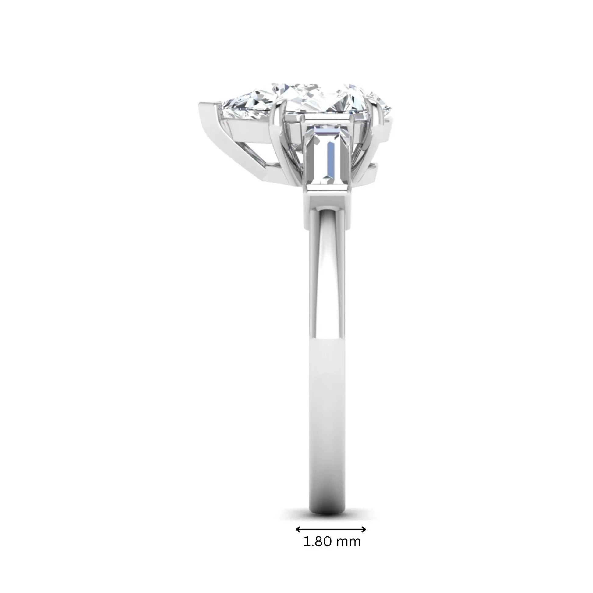 Pear cut lab grown diamond three stone engagement ring with baguette side diamonds in a classic prong setting in white gold