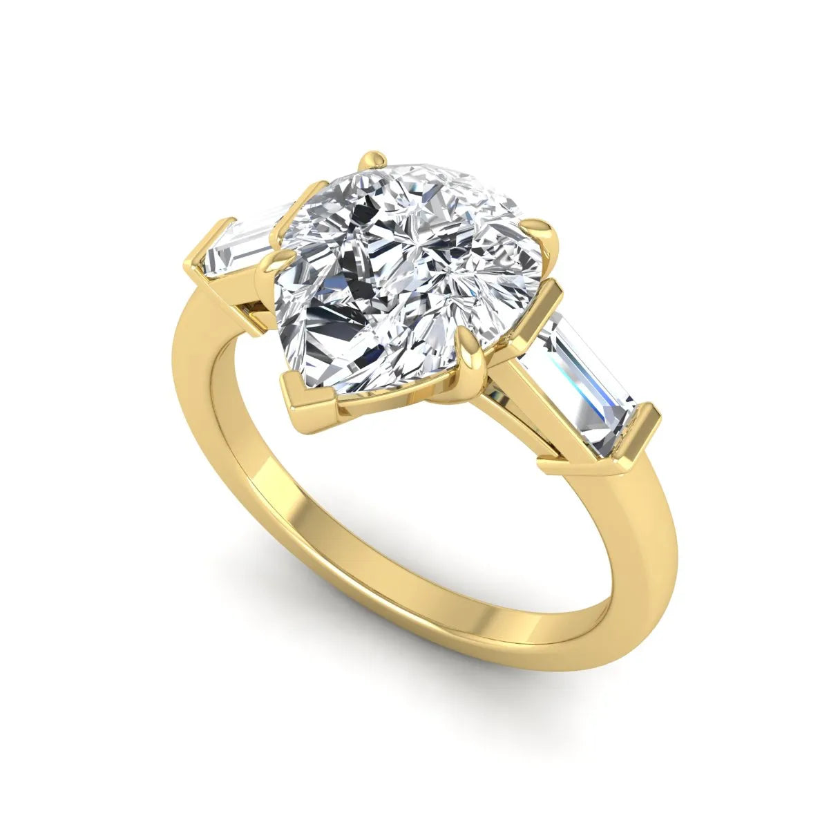 Pear cut lab grown diamond three stone engagement ring with baguette side diamonds in a classic prong setting in yellow gold