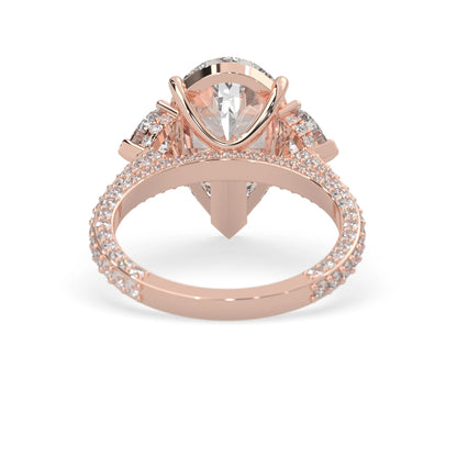 Pear three stone pave lab grown diamond cocktail ring with 6.50 carat center diamond in rose gold