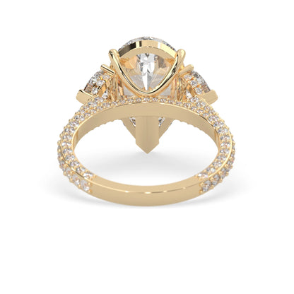 Pear three stone pave lab grown diamond cocktail ring with 6.50 carat center diamond in yellow gold