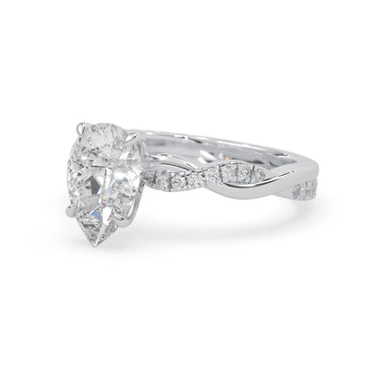 pear brilliant lab grown diamond engagement ring with prong setting and twisted pavé diamond band in white gold tone