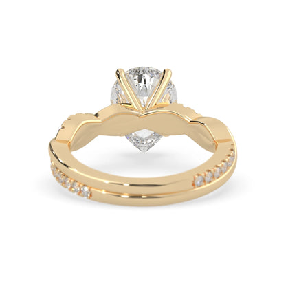 pear brilliant lab grown diamond engagement ring with prong setting and twisted pavé diamond band in yellow gold tone