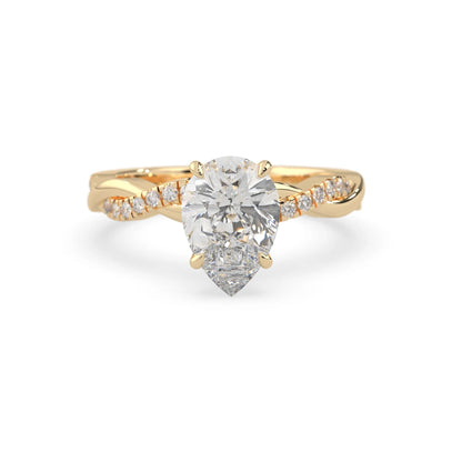 pear brilliant lab grown diamond engagement ring with prong setting and twisted pavé diamond band in yellow gold tone