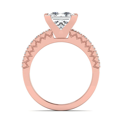 Princess cut lab grown diamond engagement ring featuring a four-prong setting with round accent diamonds on a geometric rose gold style band.